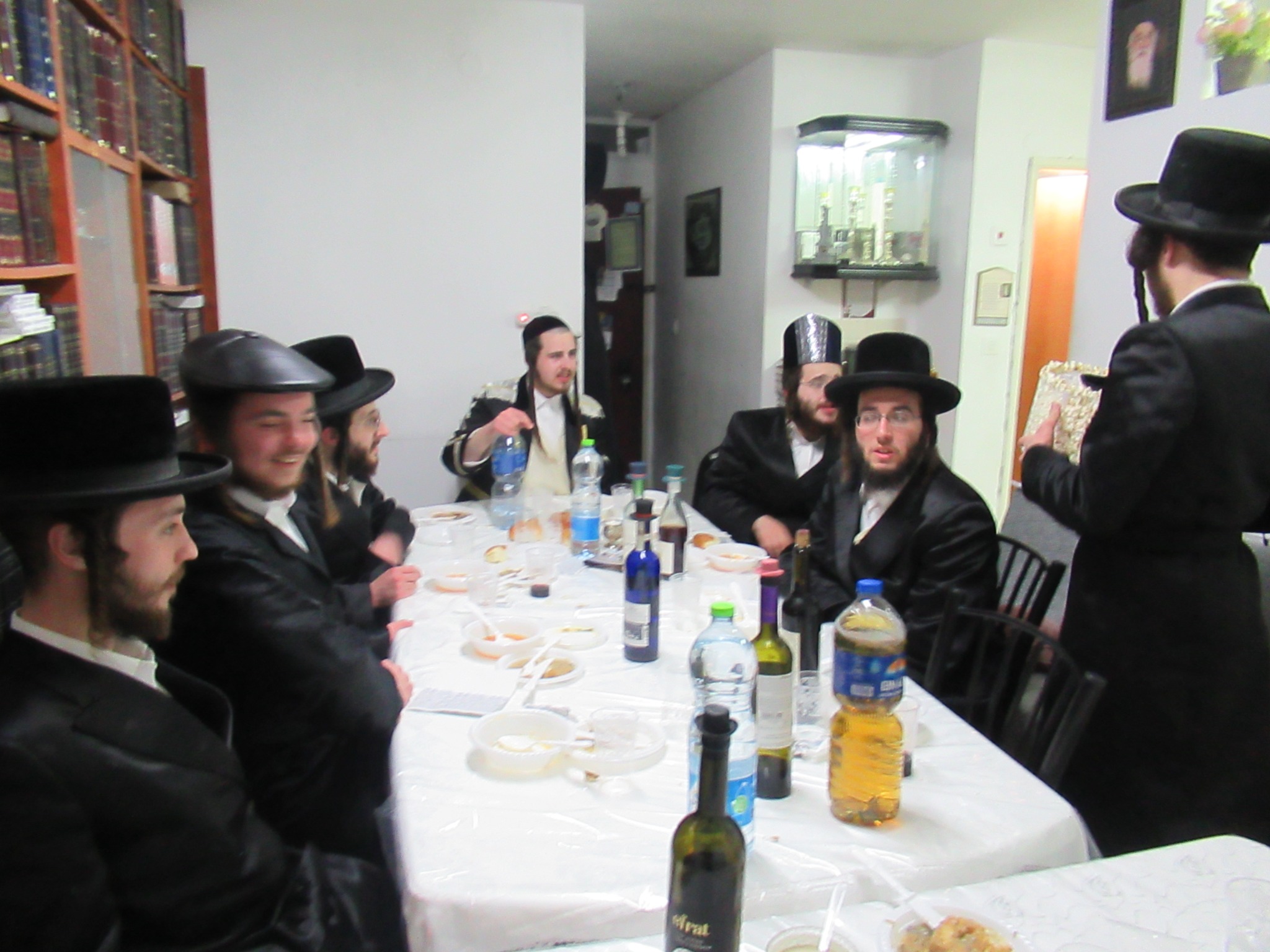 Guests gathered around the table at a Purim seudah